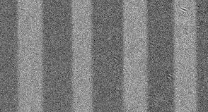 b) Simulated dispersion relation of spin waves radiated from the domain boundary. c) Snapshots of the spin wave profiles at different resonance frequencies of the domain wall oscillator.