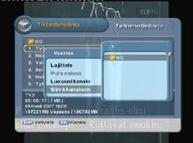 Siirrä valittu tiedosto painamalla sinistä toimintonäppäintä ja valitsemalla Siirrä kansioon ruudulta ilmestyvästä valikosta. Ruudulle ilmestyy lista saatavilla olevista kansioista.