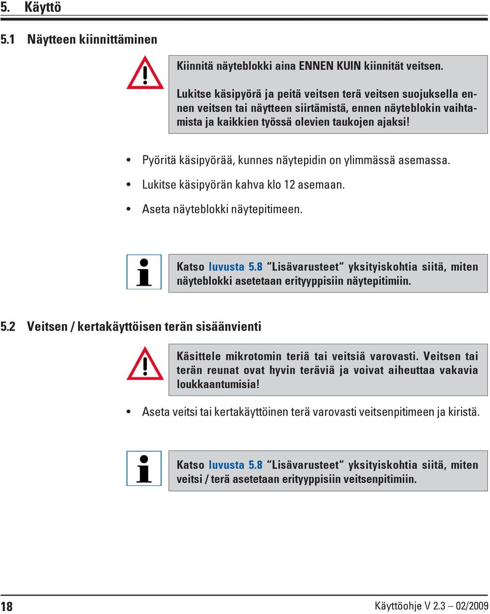 Pyöritä käsipyörää, kunnes näytepidin on ylimmässä asemassa. Lukitse käsipyörän kahva klo 12 asemaan. Aseta näyteblokki näytepitimeen. Katso luvusta 5.