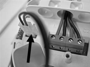 Step 2: Pass the installation cables through the holes and connect the loop cables to the terminal block. Observe correct polarity. Step 3: Connect the battery.