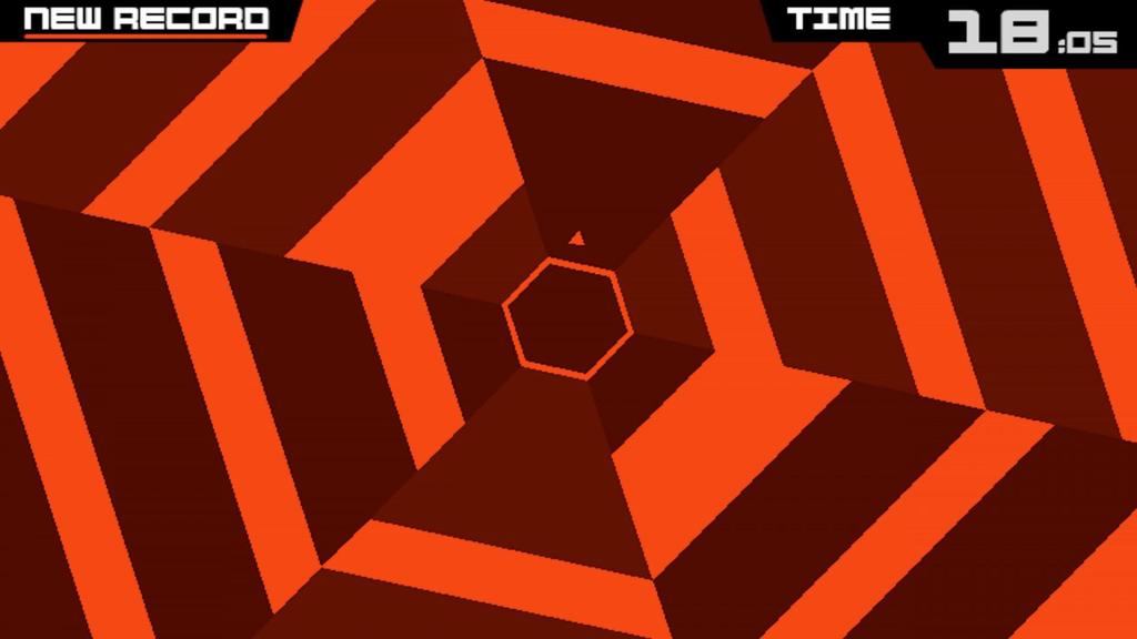 9 Kuva 1: Kuvakaappaus Super Hexagon-pelistä. Pelaaja on juuri tehnyt oman ennätyksensä 18,05 s.