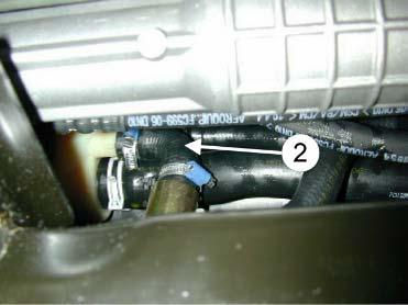 The lower union of the heater should point to the right. Fit the original hose () to the lower union of the heater, and strap it to the lower radiator hose.