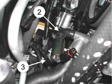 The heaters lower pipe stub pointing right. Fit the original heater hose (3) to the engine heaters lower pipe stub. Use the original spring clamp that is vulcanized onto the hose.