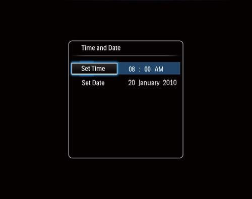 Kun käynnistät PhotoFramen ensimmäisen kerran: Näyttöön tulee kehote valita kieli. Valitse kieli ja paina Näyttöön tulee kehote asettaa aika ja päiväys.