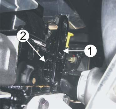 4 5/5 Remove the seats. Remove the bracket (1) which is partly placed in front of the frost plug (2) on the right side. Remove the frost plug and thoroughly clean the hole.