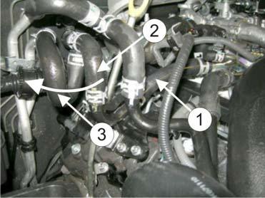 14/16 15 GB Remove the hose (1) between the engine and the pipe stub. Dismount the hose (2) from the pipe stub and turn it 90 degrees to the right (3).