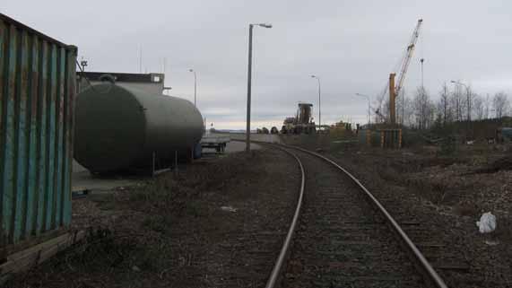 Storage containers halfway into the curve impair visibility when entering the port.