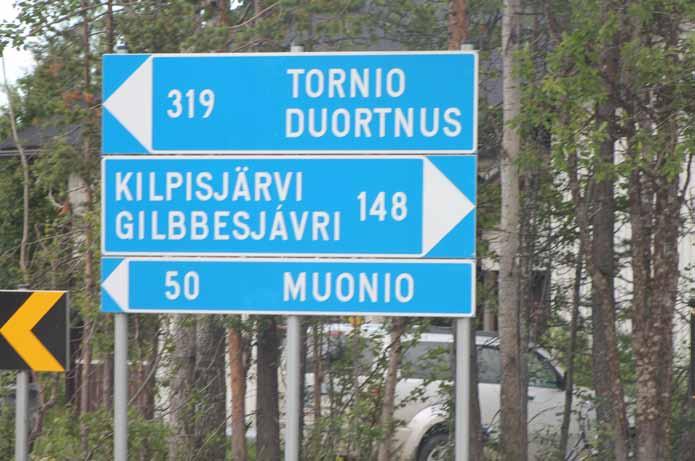 Road sign of the village in Finnish and Sámi.
