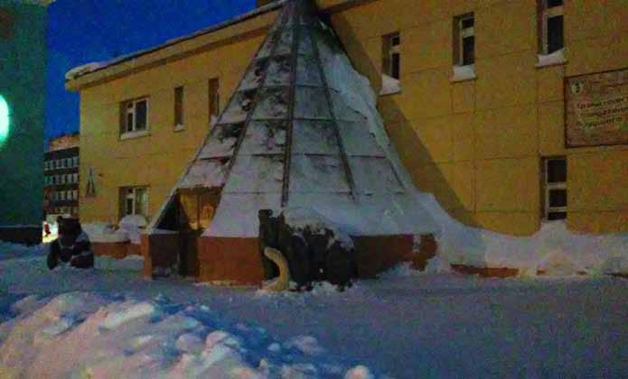 The Taimyr house of Folk Arts has a chum-like main entrance and statues of a mammoth