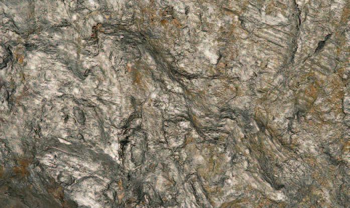 Stromatoliitteja paikallisessa dolomiittilohkareessa Kallioahossa. Mittakaavana 5-penninen (18 mm). Kuva: Vesa Perttunen, GTK, 2008 Stromatoliitteja vaakapinnalla Peuranpalon dolomiitissa.