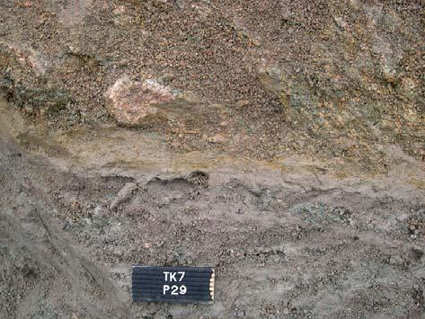granite (upper) on the wall of trench section P30.