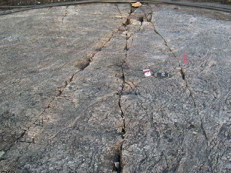 44 A B Figure 2.3-7. A) Long (>4 m), ca. N-S striking, open fractures in section P24 in investigation trench OL-TK7. B) Short, open fractures, restricted to mica gneiss inclusion, Section P5.