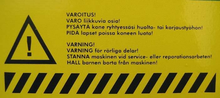 Lavan etulaidassa on seuraavanlainen varoitusmerkintä, joka tarkoittaa: KAIKKIA LIIKKUVIA OSIA TULEE VAROA!