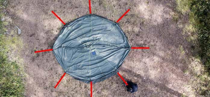 2. Put the tent s top loops within each other so that they form a cup for the end of the centre pole. 5.