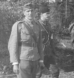 L. Jääkäriprikaatin komentaja, eversti, Mannerheim-ristin ritari Valter Nordgren ja kapteeni Yrjö K. K. Talvitie elokuussa 1944. SA-kuva. M. Markkinointijohtaja, reservin kapteeni Yrjö K. K. Talvitien kunniamerkkikiinnike ja pienoiskunniamerkkiketju, joissa ensimmäisinä: 3.