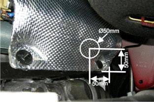 2 7/16 Before installation, remove the two clips on the heating cover. Lift up the cover and make a hole in accordance with sketch. Fit the heater in the plastic housing on the back of the engine.