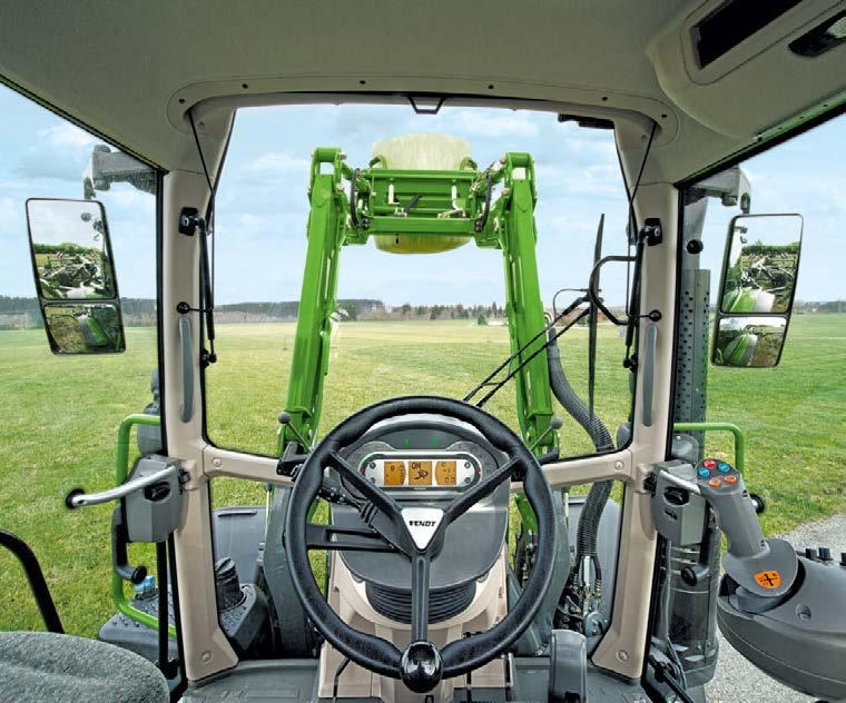 Vaimennusjärjestelmällä varustettu etukuormaaja: Kaasupainesäiliöt toimivat iskunvaimentimina estäen tärinän siirtymisen traktorin runkoon.