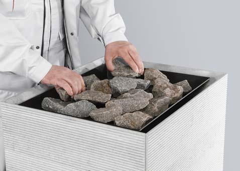 Kivitilaan voi laittaa mieltymyksen mukaan 40-60 kg kiuaskiviä. Vähäisempi kivimäärä antaa napakammat löylyt ja kiuas lämpiää nopeammin.