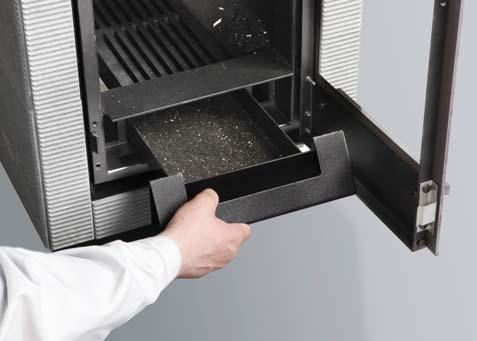 Before lighting a fire, clean the grate and empty the ash box3 3. Remove the ash box by lifting it first and then pulling it out carefully.