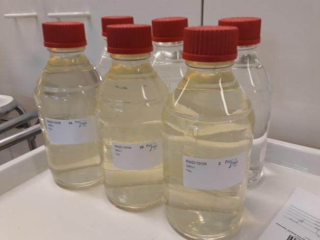 Figure 1. Sample bottles in RAD 06/2019. In the front is the, slightly colored and turbid sample GRn1, and in the back colourless sample GRn2.