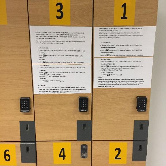 Käyttöohje löytyy lokerikkojen ovesta. Pyri käyttämään saman numeroista lokerikkoa kuin mikä on tenttikoneesi numero.
