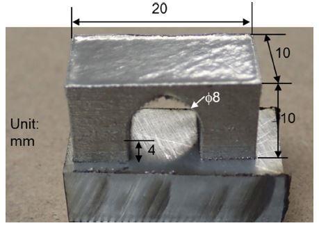 27 and cool-down mechanism. The highest stress value can be obtained in the lower corners of the block that are attached to the building platform (grey area), acting tensile stress.