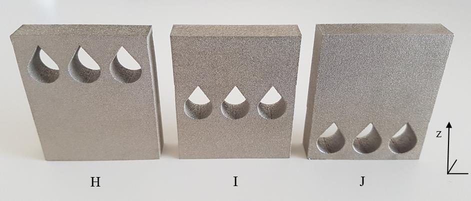 No deformation can be observed in test sample E2 in figure 54. Test samples H, I and J are represented in figure 55. Figure 55. Test samples H, I and J. Building direction along z-axis.