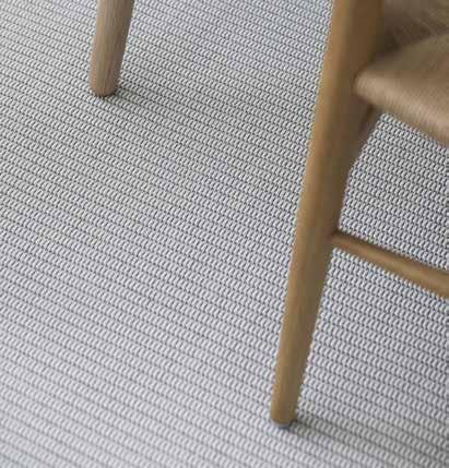 The Meirami rug s cotton and paper yarn blend in with each other, forming a beautiful, simplified design.