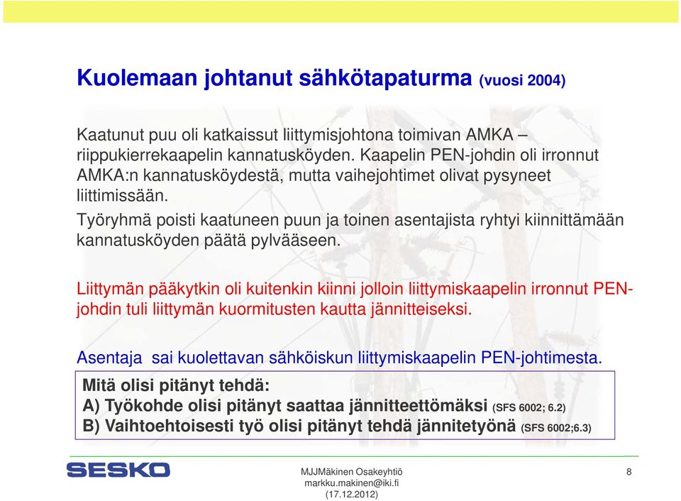 Työryhmä poisti kaatuneen puun ja toinen asentajista ryhtyi kiinnittämään kannatusköyden päätä pylvääseen.