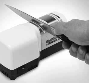 Stage 1 To sharpen, place the sharpener on the table gripping it securely with your left hand. Push on the power switch.