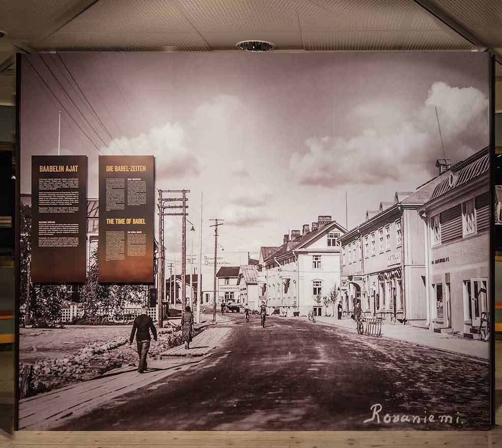 On the left BABEL TIMES - Labouring and working for germans Baabelin ajat / finnish Babel time /deutch and english The big picture is sticker, not touring with exhibition (but we have this picture if