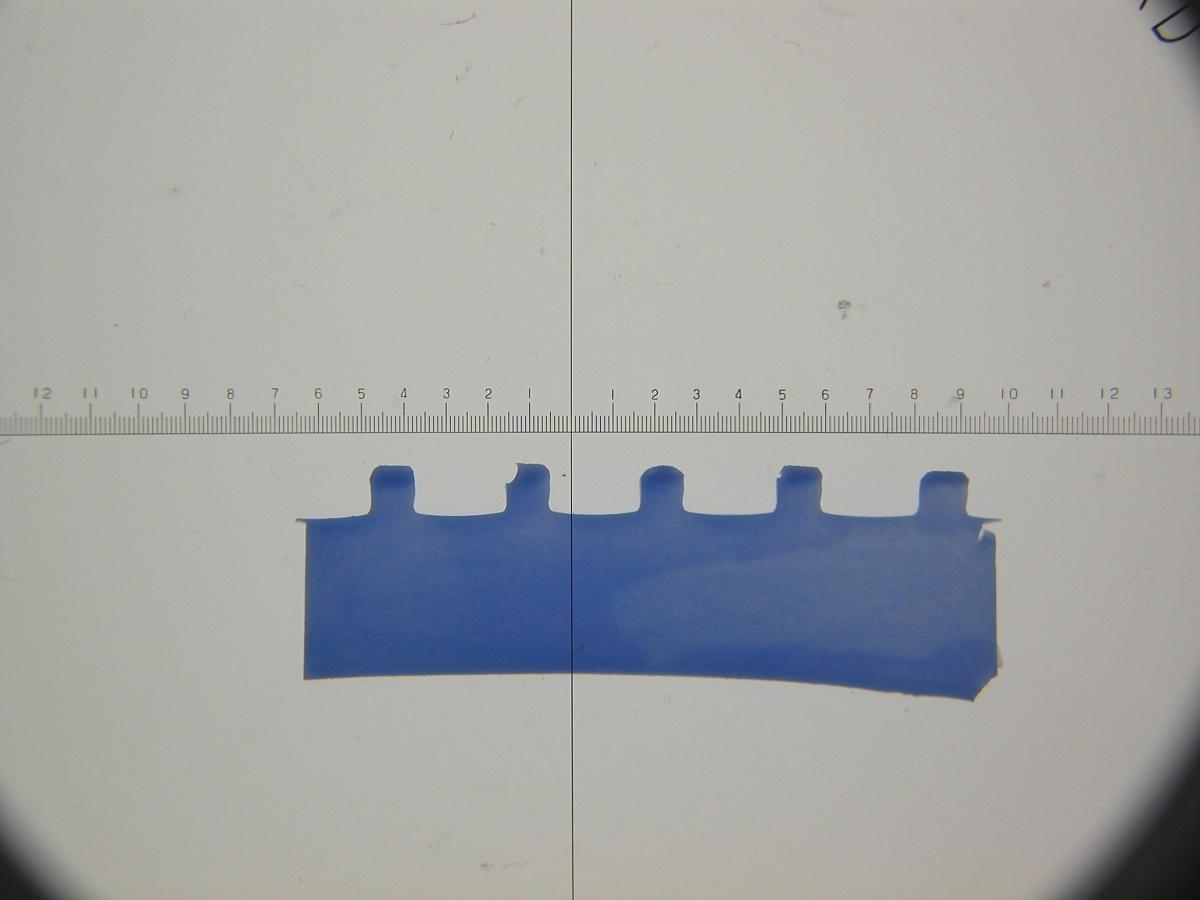 KUVA 9 Leikattu siivu mitta-asteikon kanssa (Juha Nieminen: Belt castin analysis.