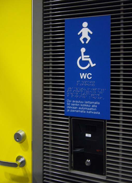 Tarvittaessa käytetään lisäksi kuvasymbolia, josta ilmenee, kummalla puolella wc-istuinta on vapaa tila pyörätuolia varten, kuva 14.