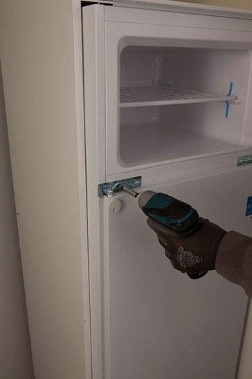 8) - Slightly pull out the fridge from its cabinet, unscrew the fridge