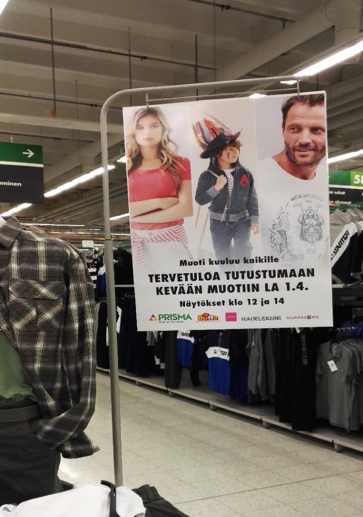 50 KUVA 1. Muotinäytöksen mainontaa myymälässä 6.