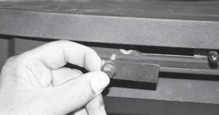 The vertical position of the handle can be adjusted by turning the set screw on the