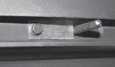 Position the adaptor plate against the front casting, aligning the centre hole with the