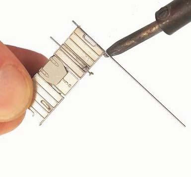 61 Portinhaka Taivuta 0,3mm:n metallilangasta kuvankaltainen