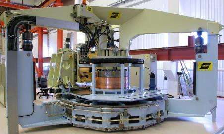 The canister rotates during welding, but in alternative desing the machine would rotate around the canister.