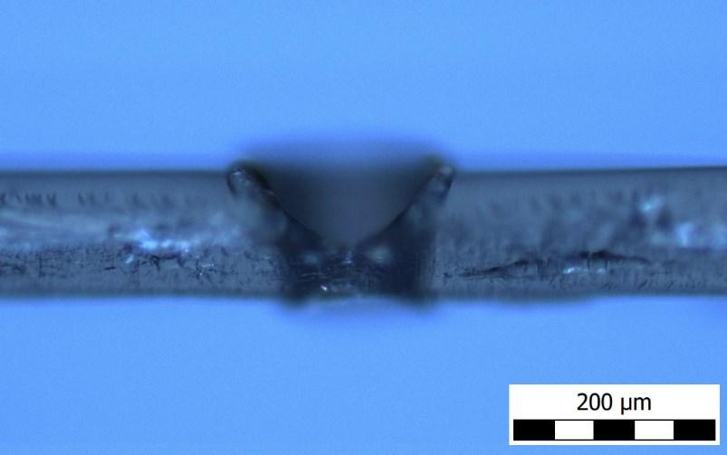 34 from an offset in the laser focal point and the thickness of PET and conduction deformations from the heat applied.