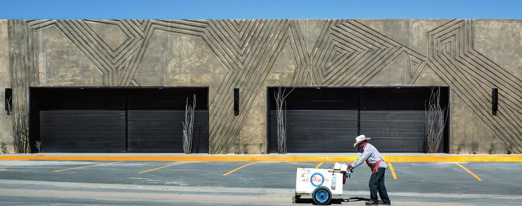 Tattooed concrete on facades Anapra Colony with about 25 000 residents has been established in northern Mexico over the last few decades.